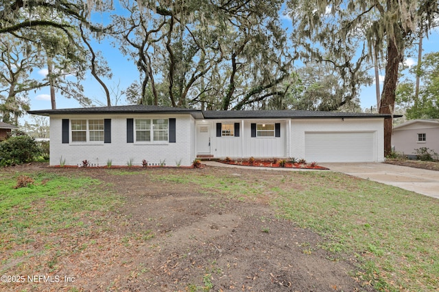 ranch-style house featuring a garage, concrete driveway, brick siding, and a front yard