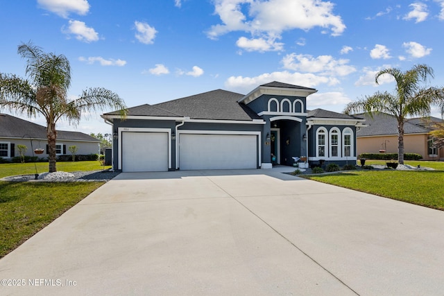 986 Prairie Dunes Ct, Orange Park, FL 32065 - view of front of property with a front yard, an attached garage, stucco siding, and concrete driveway