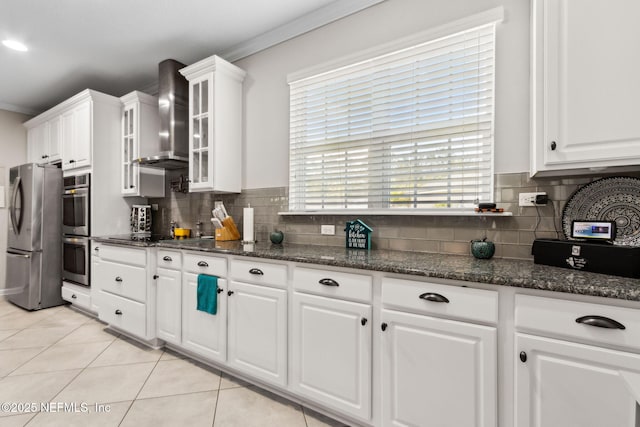 986 Prairie Dunes Ct, Orange Park, FL 32065 - kitchen with white cabinets, appliances with stainless steel finishes, crown molding, and wall chimney exhaust hood