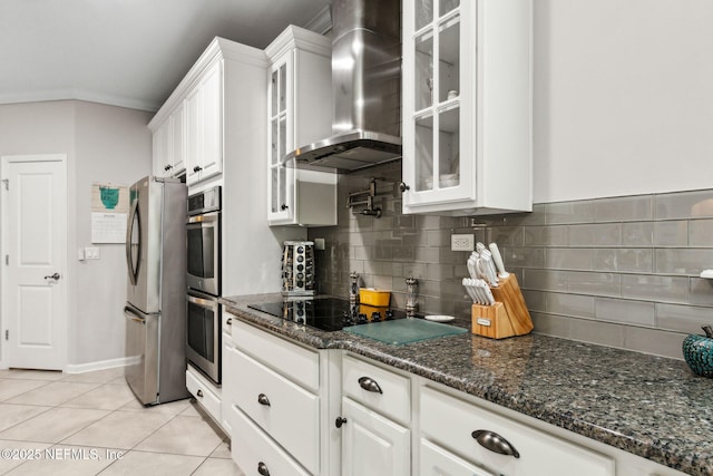 986 Prairie Dunes Ct, Orange Park, FL 32065 - kitchen with wall chimney range hood, white cabinetry, appliances with stainless steel finishes, and light tile patterned floors