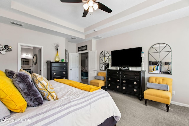 986 Prairie Dunes Ct, Orange Park, FL 32065 - bedroom with connected bathroom, carpet flooring, a raised ceiling, baseboards, and visible vents