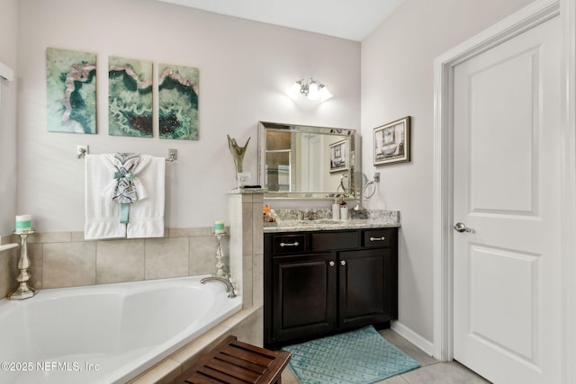 986 Prairie Dunes Ct, Orange Park, FL 32065 - bathroom featuring a garden tub, tile patterned flooring, and vanity