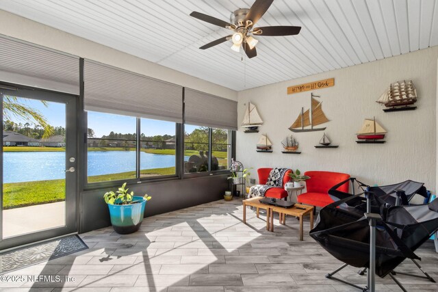 986 Prairie Dunes Ct, Orange Park, FL 32065 - sunroom featuring a ceiling fan, a water view, and wood finished floors
