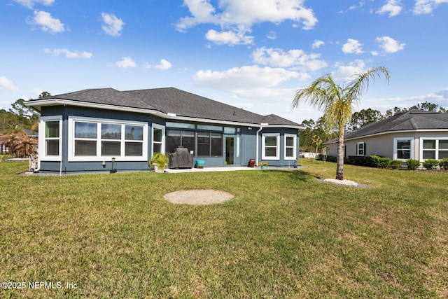986 Prairie Dunes Ct, Orange Park, FL 32065 - rear view of house with a sunroom and a lawn