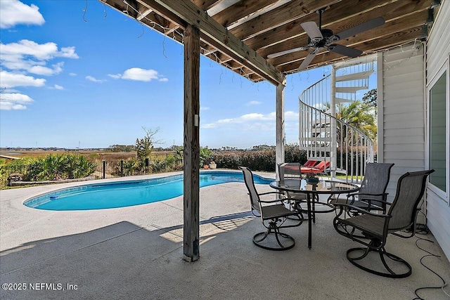 view of swimming pool featuring a fenced in pool, a ceiling fan, a patio, stairway, and fence