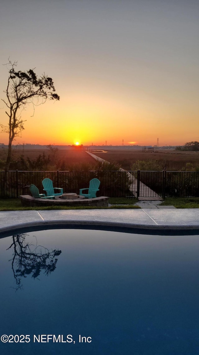 view of swimming pool with fence and a fenced in pool