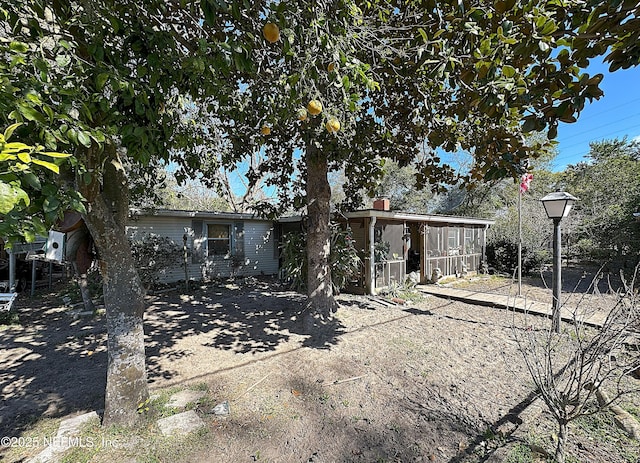 rear view of house with a chimney