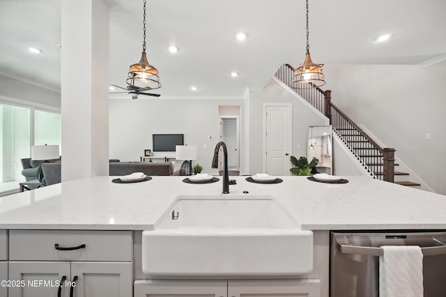 152 Navigators Rd, Saint Johns, FL 32259 - kitchen with light stone counters, a sink, hanging light fixtures, open floor plan, and dishwasher