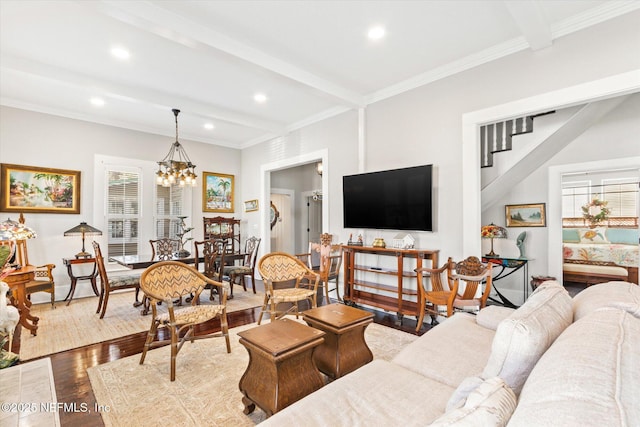 living area featuring recessed lighting, a notable chandelier, beamed ceiling, and wood finished floors