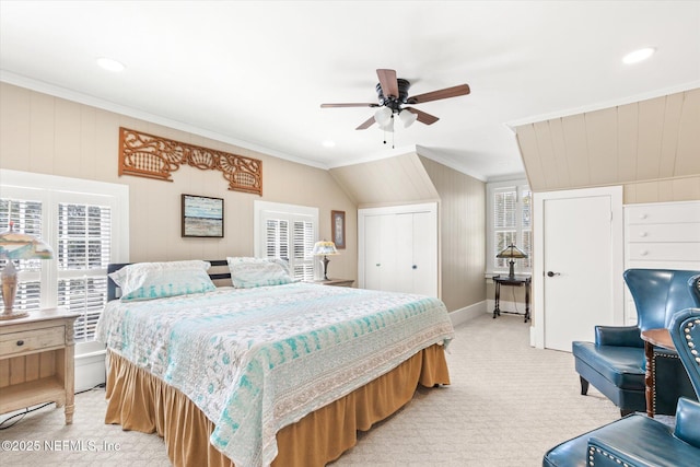 bedroom featuring light colored carpet, crown molding, and multiple windows