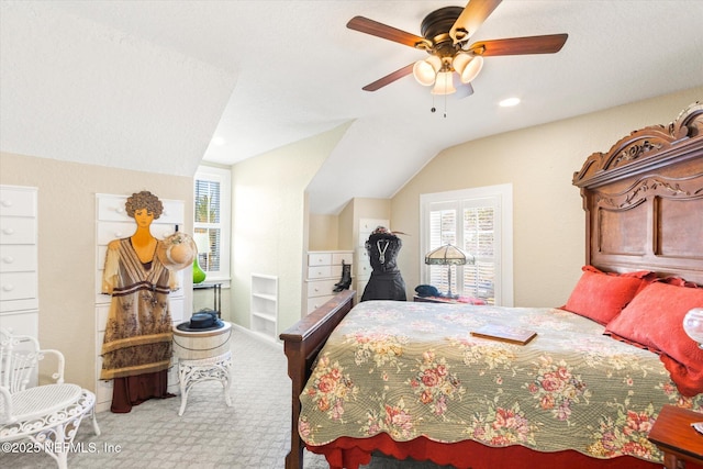 bedroom with light carpet, vaulted ceiling, and ceiling fan