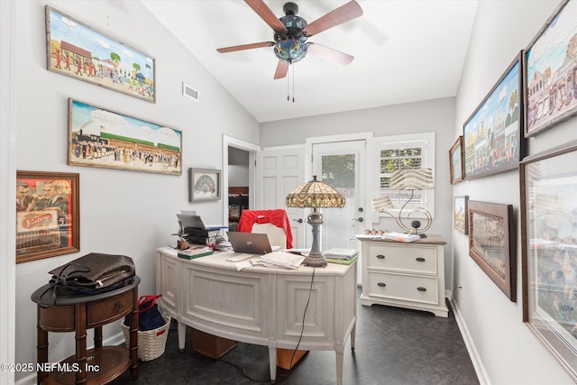 home office with visible vents, vaulted ceiling, baseboards, and ceiling fan