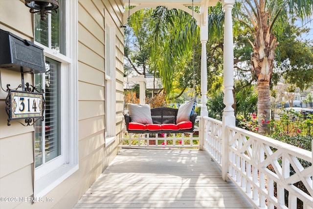 wooden terrace featuring a porch