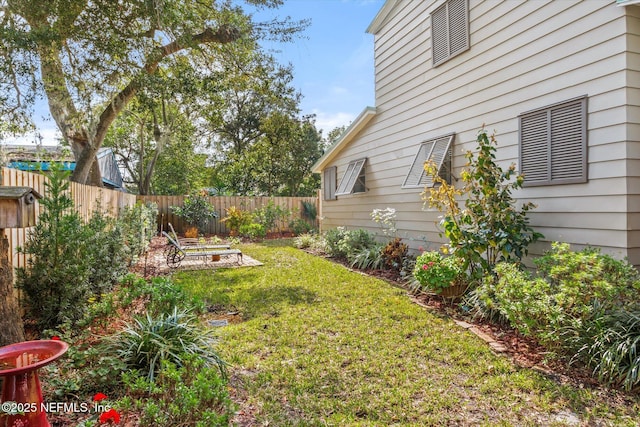 view of yard with a fenced backyard