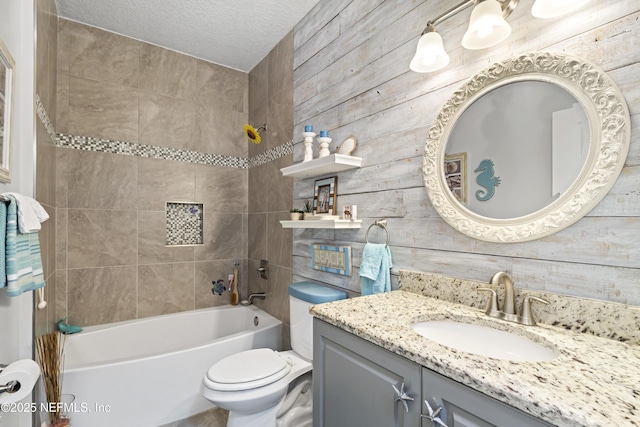 bathroom featuring  shower combination, toilet, a textured ceiling, and vanity