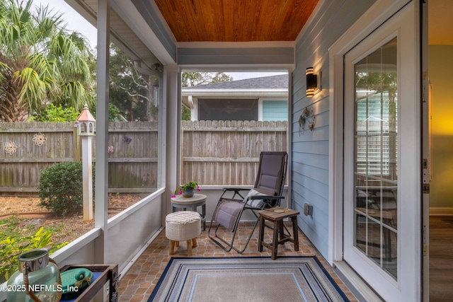 sunroom featuring wooden ceiling