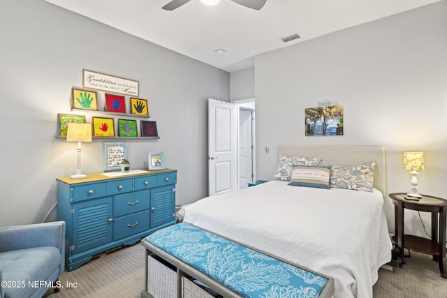 bedroom featuring a ceiling fan, light colored carpet, and visible vents