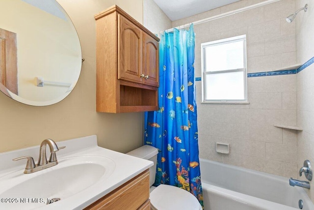 full bath featuring shower / bath combination with curtain, vanity, and toilet