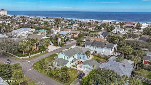 birds eye view of property with a water view and a residential view