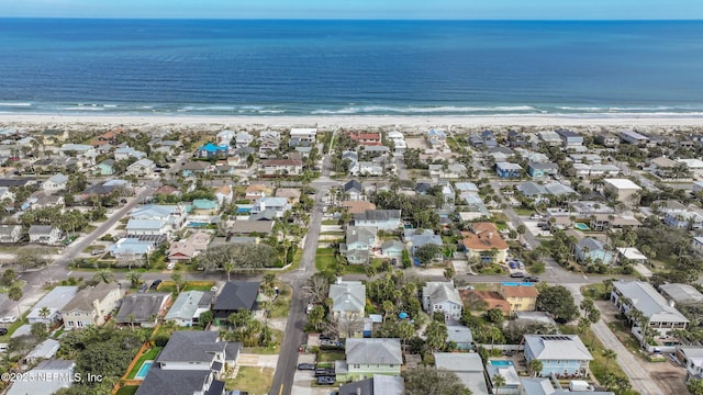 bird's eye view with a water view, a residential view, and a view of the beach