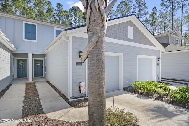 view of front of property with a garage and board and batten siding