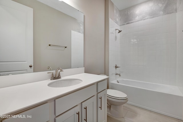 bathroom with toilet, tub / shower combination, vanity, and tile patterned floors