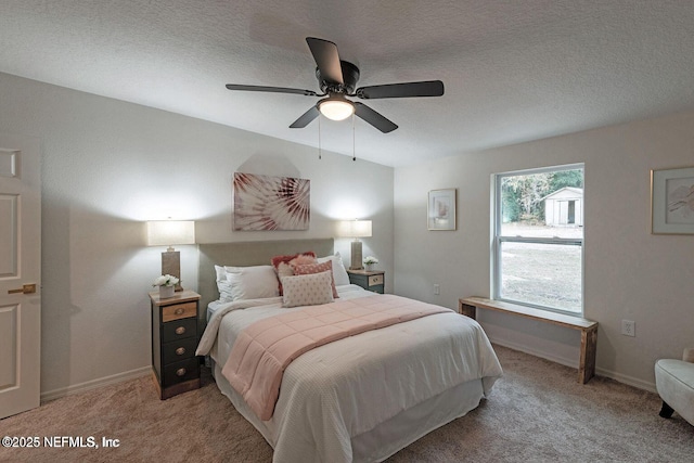 bedroom with light carpet, a textured ceiling, and baseboards