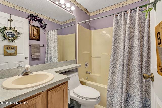 full bathroom featuring a textured ceiling, shower / bath combo with shower curtain, vanity, and toilet