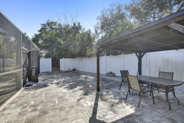 view of patio with a fenced backyard and outdoor dining space