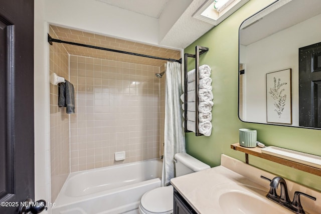 bathroom with vanity, a skylight, toilet, and shower / bathtub combination with curtain