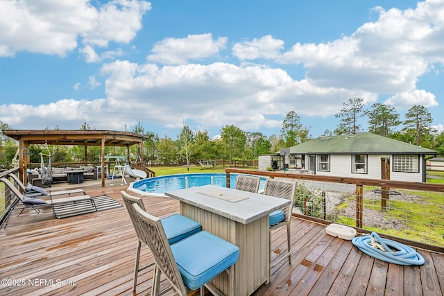 wooden terrace with outdoor lounge area and outdoor dining space