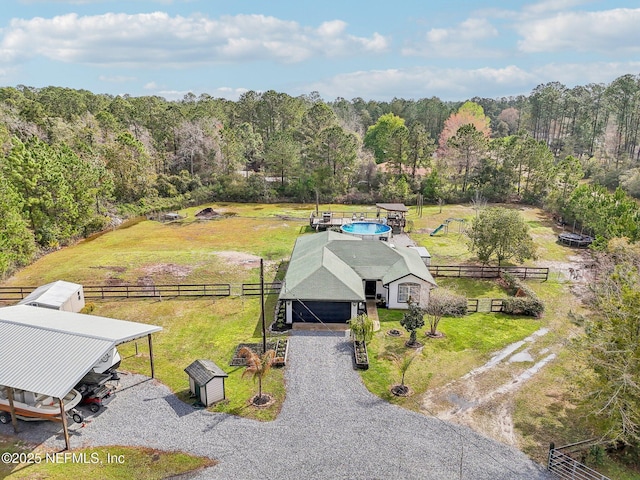 birds eye view of property with a rural view and a forest view