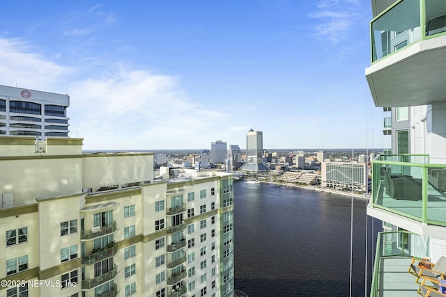 balcony featuring a water view and a view of city