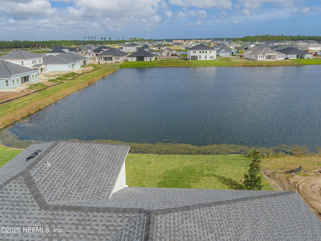 aerial view with a water view and a residential view