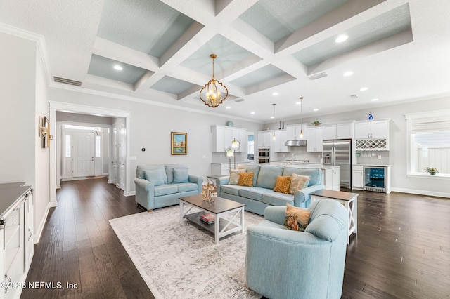 living area with dark wood-type flooring, coffered ceiling, and visible vents