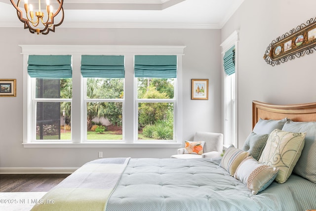 bedroom featuring baseboards, multiple windows, ornamental molding, and dark wood-style flooring