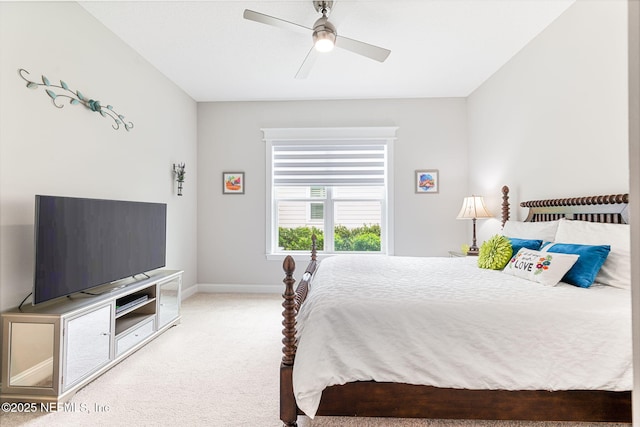 bedroom with baseboards, a ceiling fan, and light colored carpet