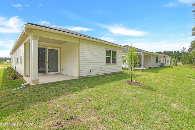950 Lightsey Crossing Ln, Saint Augustine, FL 32084 - rear view of house featuring a patio and a yard