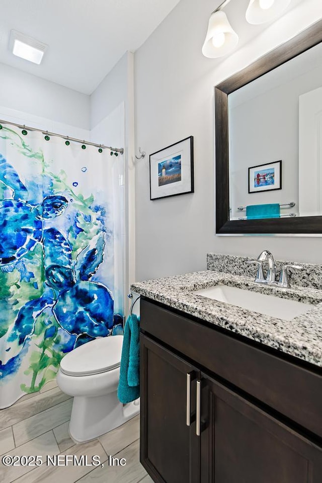 34072 Lavender Parke Dr, Fernandina Beach, FL 32034 - full bath with visible vents, vanity, and toilet