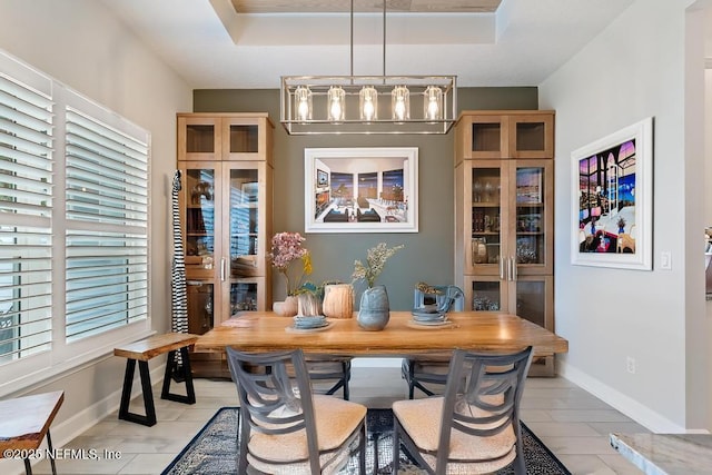34072 Lavender Parke Dr, Fernandina Beach, FL 32034 - dining space with baseboards and a tray ceiling