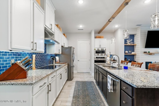 34072 Lavender Parke Dr, Fernandina Beach, FL 32034 - kitchen featuring pendant lighting, appliances with stainless steel finishes, white cabinetry, a sink, and under cabinet range hood