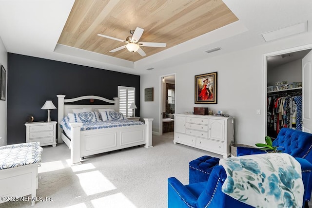 34072 Lavender Parke Dr, Fernandina Beach, FL 32034 - bedroom featuring ceiling fan, wooden ceiling, light colored carpet, visible vents, and a tray ceiling
