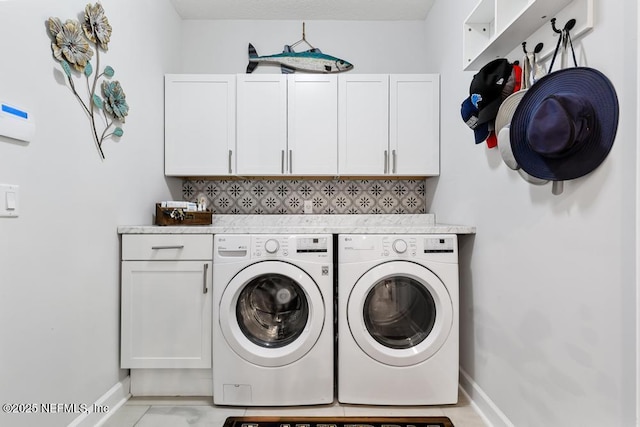 34072 Lavender Parke Dr, Fernandina Beach, FL 32034 - laundry area with washer and dryer, cabinet space, and baseboards