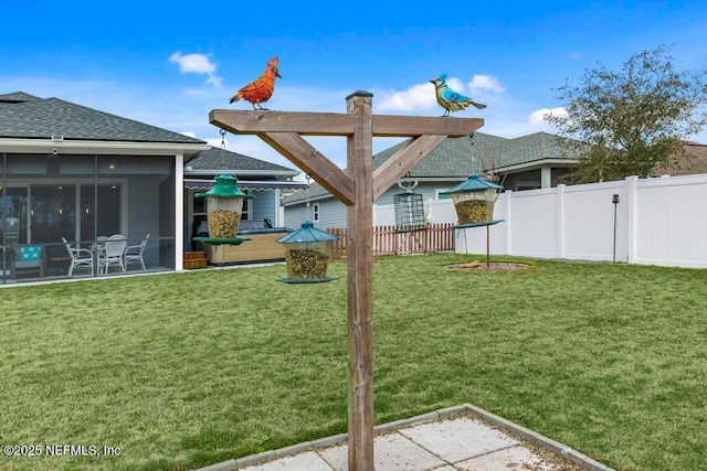 34072 Lavender Parke Dr, Fernandina Beach, FL 32034 - view of yard featuring a sunroom, fence, and a patio