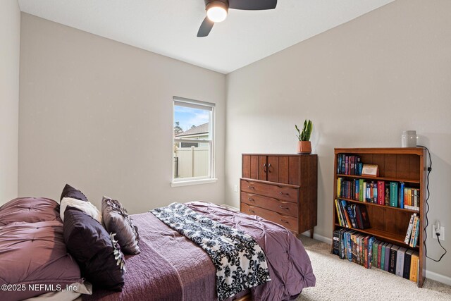 bedroom featuring a ceiling fan, carpet flooring, and baseboards