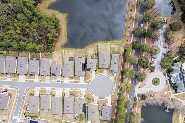 bird's eye view with a water view and a residential view