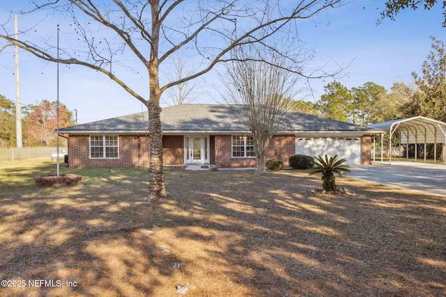 ranch-style house with a carport, driveway, brick siding, and an attached garage