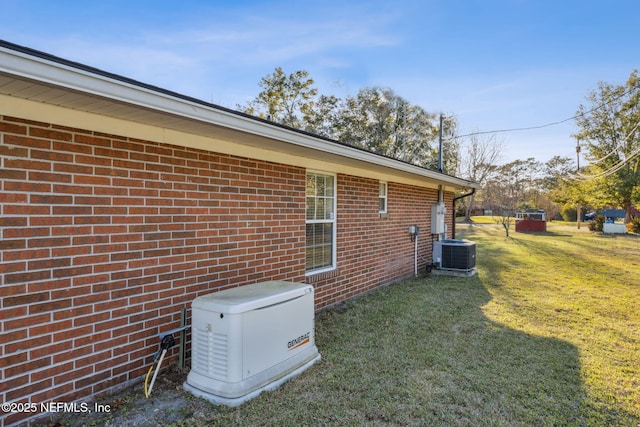 view of home's exterior with central AC unit, a lawn, and brick siding