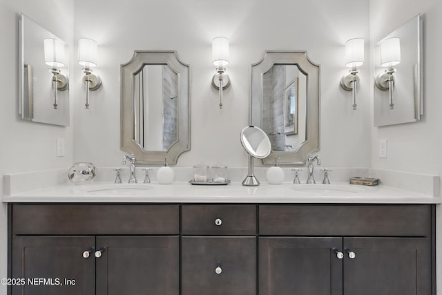 full bathroom featuring a sink and double vanity