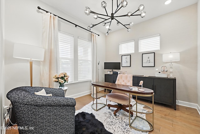 office space with wood finished floors and baseboards